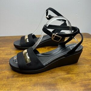 Crocs Leigh Ann Black Wedge Sandals with Gold Accents